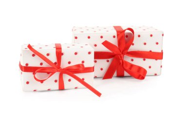 Gift boxes with red satin ribbon isolated on white background. Valentine's Day celebration