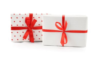 Gift boxes with red satin ribbon isolated on white background. Valentine's Day celebration