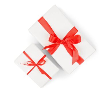 Gift boxes with red satin ribbon isolated on white background. Valentine's Day celebration