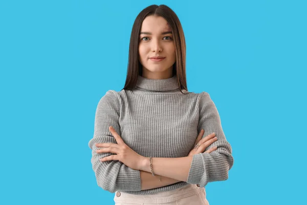 Young Woman Grey Sweater Blue Background — Foto Stock