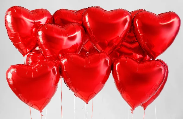Heart shaped balloons for Valentine\'s Day on light background