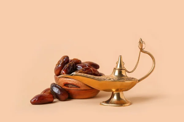 Aladdin lamp of wishes and dates for Ramadan on beige background