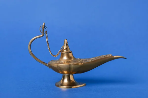 Aladdin lamp of wishes for Ramadan on blue background
