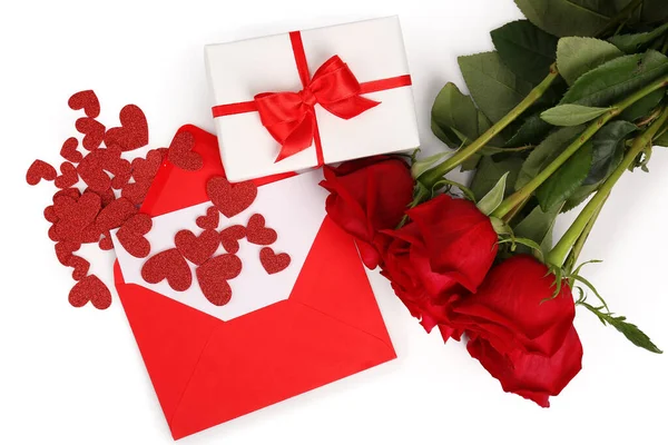 Gift boxes, rose flowers, envelope and hearts isolated on white background. Valentine\'s Day celebration