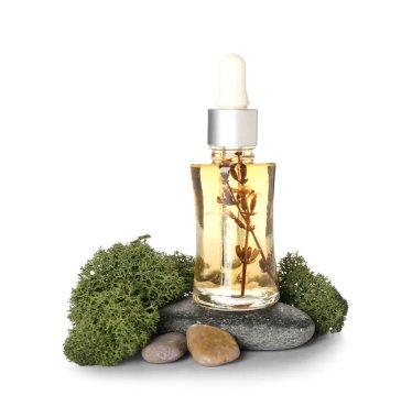 Cosmetic dropper bottle, pebbles and green moss on white background