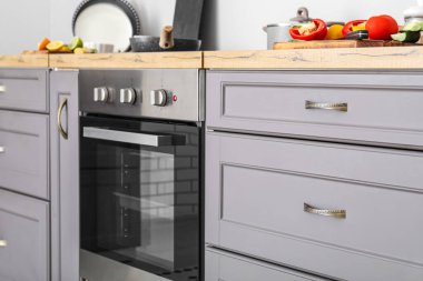 Grey counters with drawers in modern kitchen, closeup