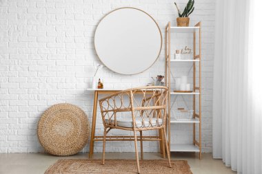 Interior of stylish makeup room with table, mirror and shelving unit