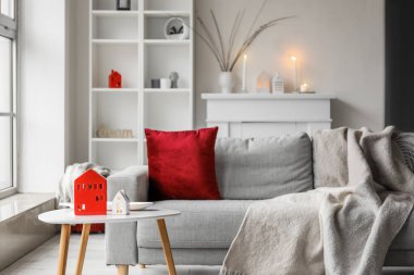 House candle holders on table in interior of living room