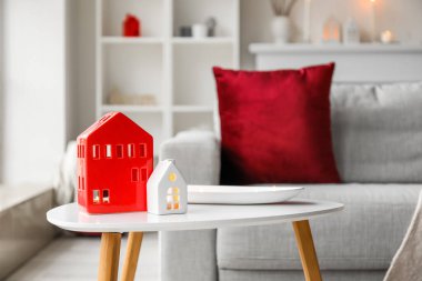 House candle holders on table in living room, closeup