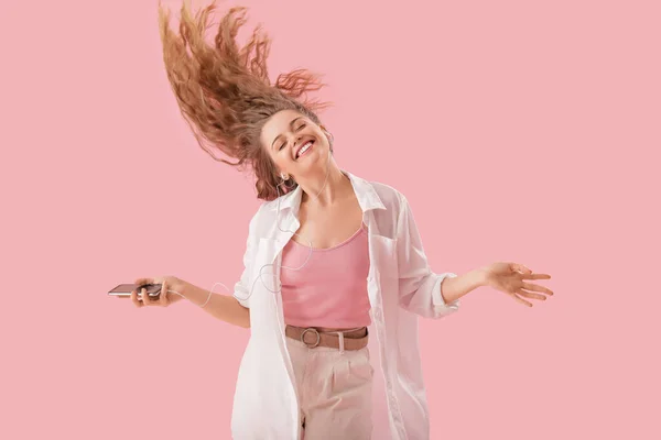 Young Woman Earphones Mobile Phone Dancing Pink Background — Stock fotografie