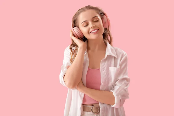 Young Woman Headphones Listening Music Pink Background — Stock fotografie