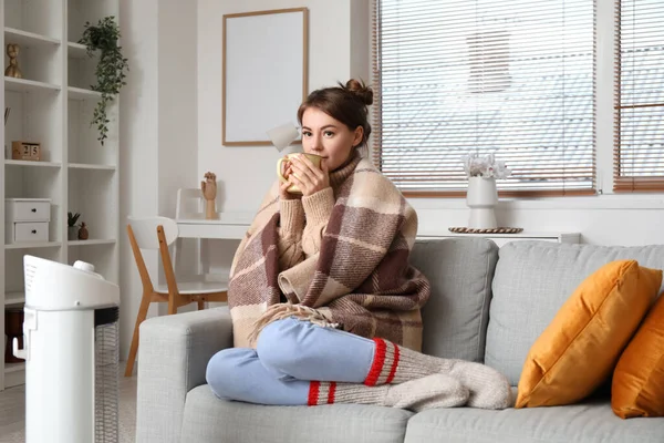 Frozen Young Woman Cup Hot Tea Warming Electric Heater Home — Stock Photo, Image