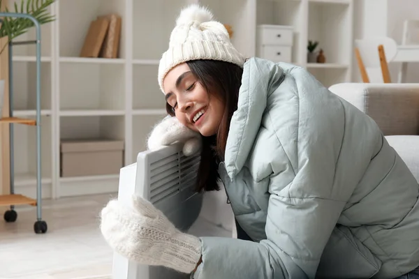 Happy Young Woman Winter Clothes Warming Radiator Home — Stock Photo, Image