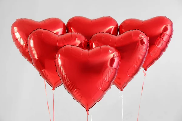 Heart shaped balloons for Valentine\'s Day on light background
