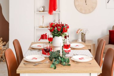 Table setting for Valentine's Day with beautiful flowers in dining room