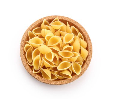 Plate of raw conchiglioni pasta on white background