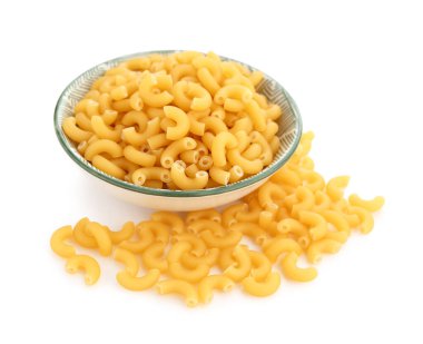 Bowl of raw elbow pasta on white background