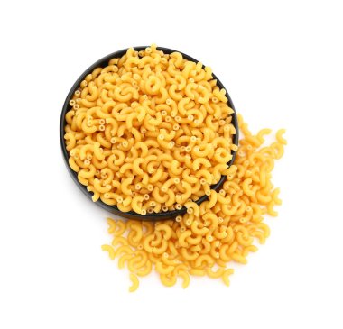 Plate of raw elbow pasta isolated on white background