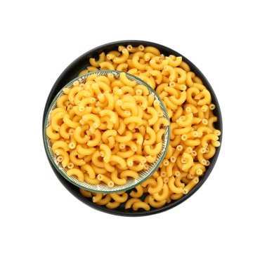 Plate of uncooked elbow pasta on white background