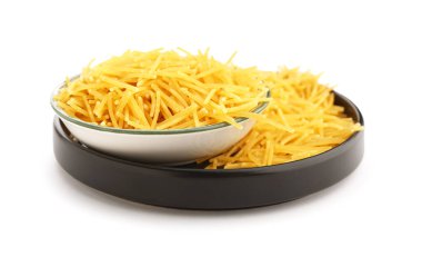 Bowl and plate of raw vermicelli pasta on white background