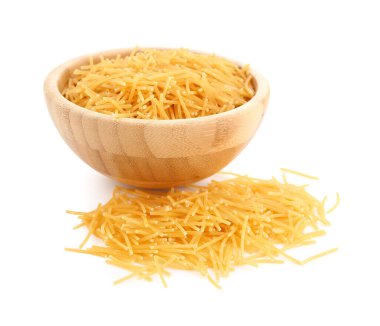 Wooden bowl of raw vermicelli pasta on white background