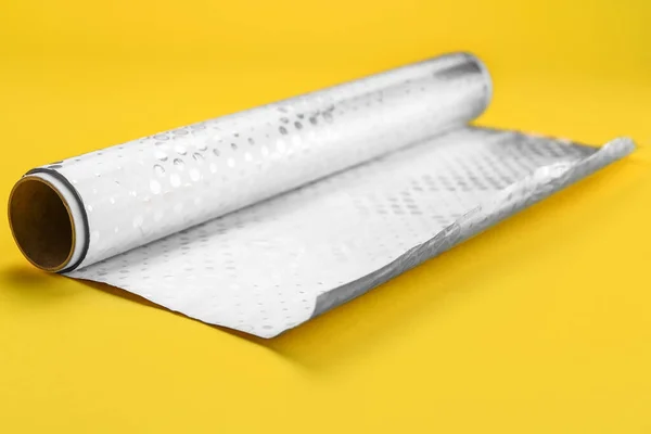 Roll Aluminium Foil Yellow Background — Stock Photo, Image