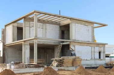 View of unfinished cottage on construction site
