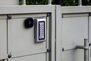Modern intercom on metal fence