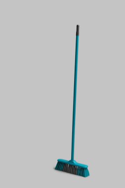 Blue cleaning broom on white background