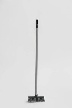 Sweeping broom on white background