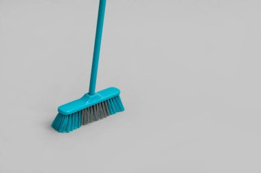 Blue cleaning broom on white background