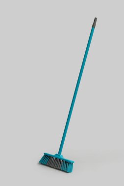 Blue cleaning broom on white background