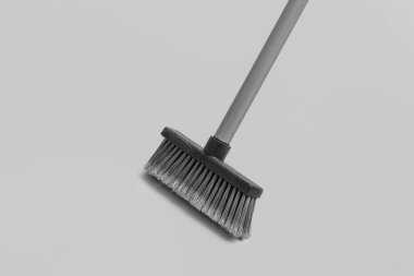 Sweeping broom on white background