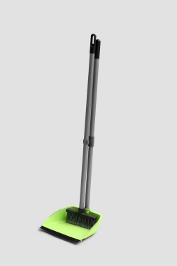 Dustpan with cleaning broom on white background