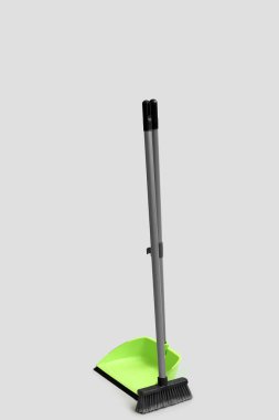 Dustpan with cleaning broom on white background