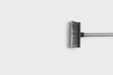Sweeping broom on white background