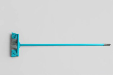 Blue sweeping broom on white background