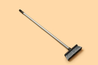 Broom for cleaning on color background