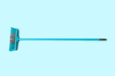 Cleaning broom on blue background