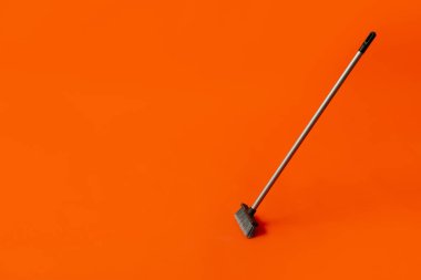 Plastic cleaning broom on color background