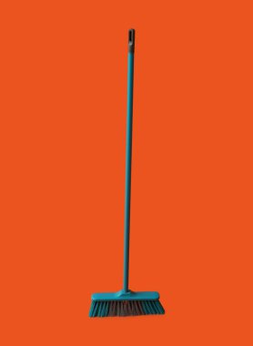 Plastic broom for cleaning on color background
