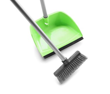 Cleaning broom with dustpan on white background