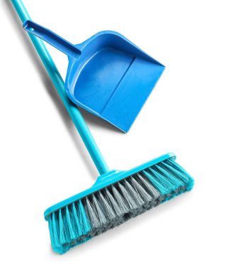 Blue dustpan and broom on white background