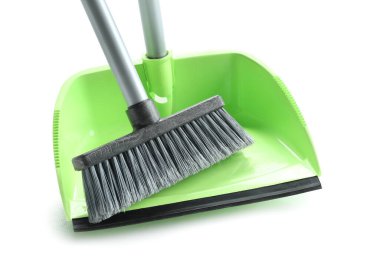 Cleaning broom with dustpan on white background, closeup