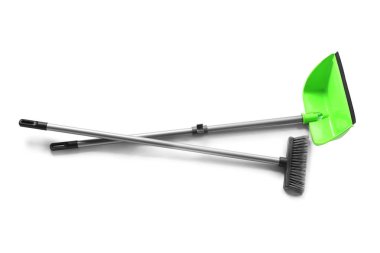 Cleaning broom with dustpan on white background
