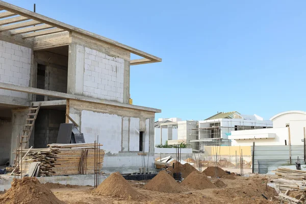 View of unfinished cottage on construction site