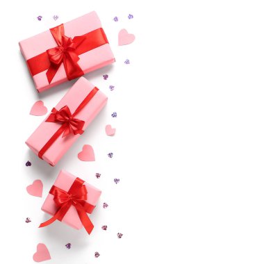 Composition with gift boxes, sequins and paper hearts on white background. Valentine's Day celebration