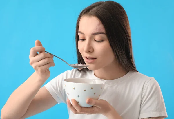 Young Woman Eating Corn Balls Silver Spoon Blue Background Closeup — Stock Photo, Image