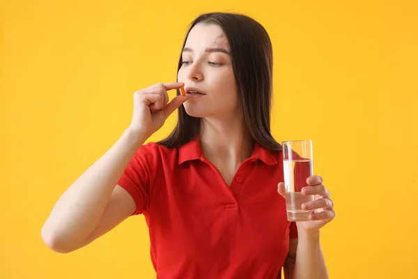 Young Woman Glass Water Taking Vitamin Supplement Yellow Background — Stock Photo, Image