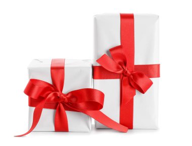 Gift boxes with beautiful bows isolated on white background. Valentine's Day celebration